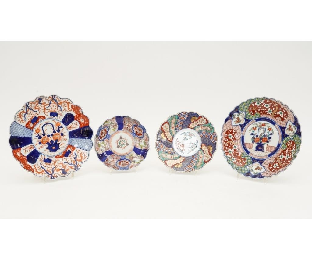 Appraisal: Four colorful Japanese scallop-rimmed Imari plates th c Largest dia