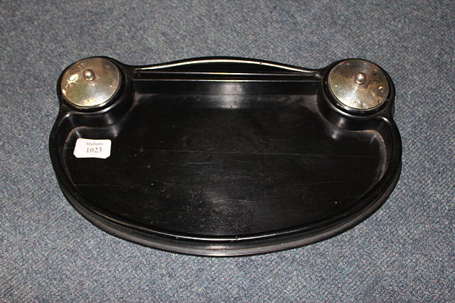 Appraisal: AN EBONISED DRESSING TABLE STAND of shaped outline with silver