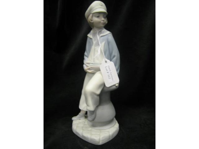 Appraisal: Lladro Figurine Boy with Yacht tall bisque finish excellent