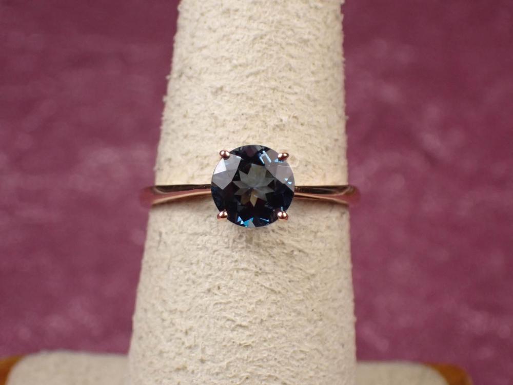 Appraisal: LONDON BLUE TOPAZ AND FOURTEEN KARAT GOLD RING The rose