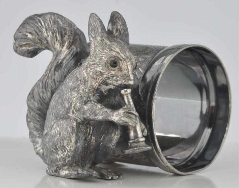 Appraisal: Squirrel with Glass Eyes Figural Napkin Ring Squirrel blows horn