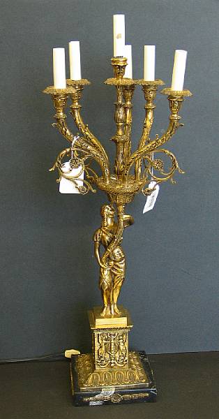 Appraisal: A pair of Empire style brass figural six-light candelabra lamps