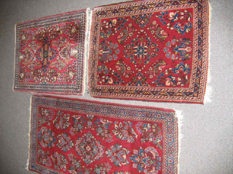 Appraisal: THREE MID TH CENTURY SAROUK THROW RUGS Each having a