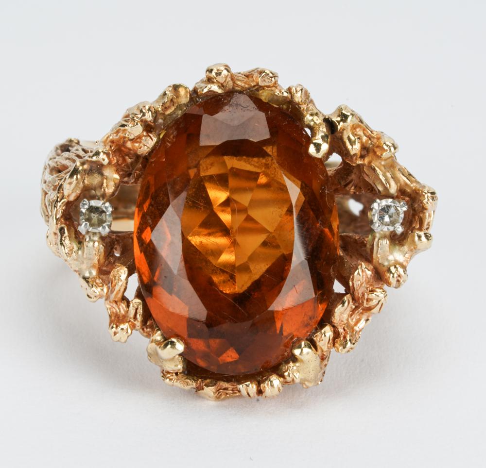 Appraisal: KARAT YELLOW GOLD DIAMOND CITRINE RINGcentering one oval citrine weighing