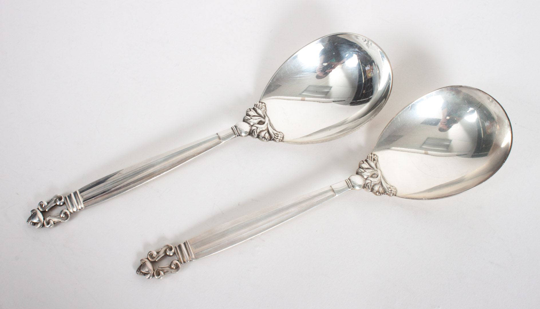 Appraisal: Two Georg Jensen sterling silver serving spoons in the Acorn