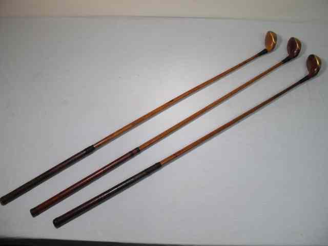 Appraisal: Three MacGregor fancy face wood shaft golf clubs All three