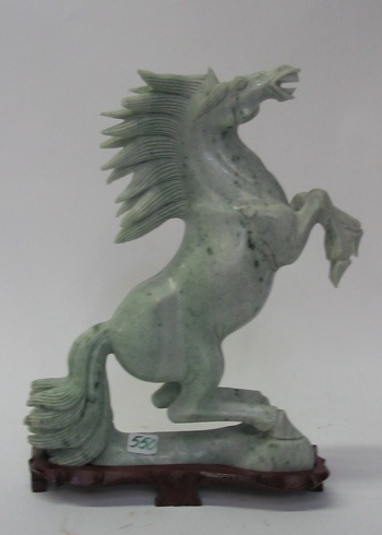 Appraisal: A CHINESE CARVED SERPENTINE FIGURAL HORSE of a raring stallion