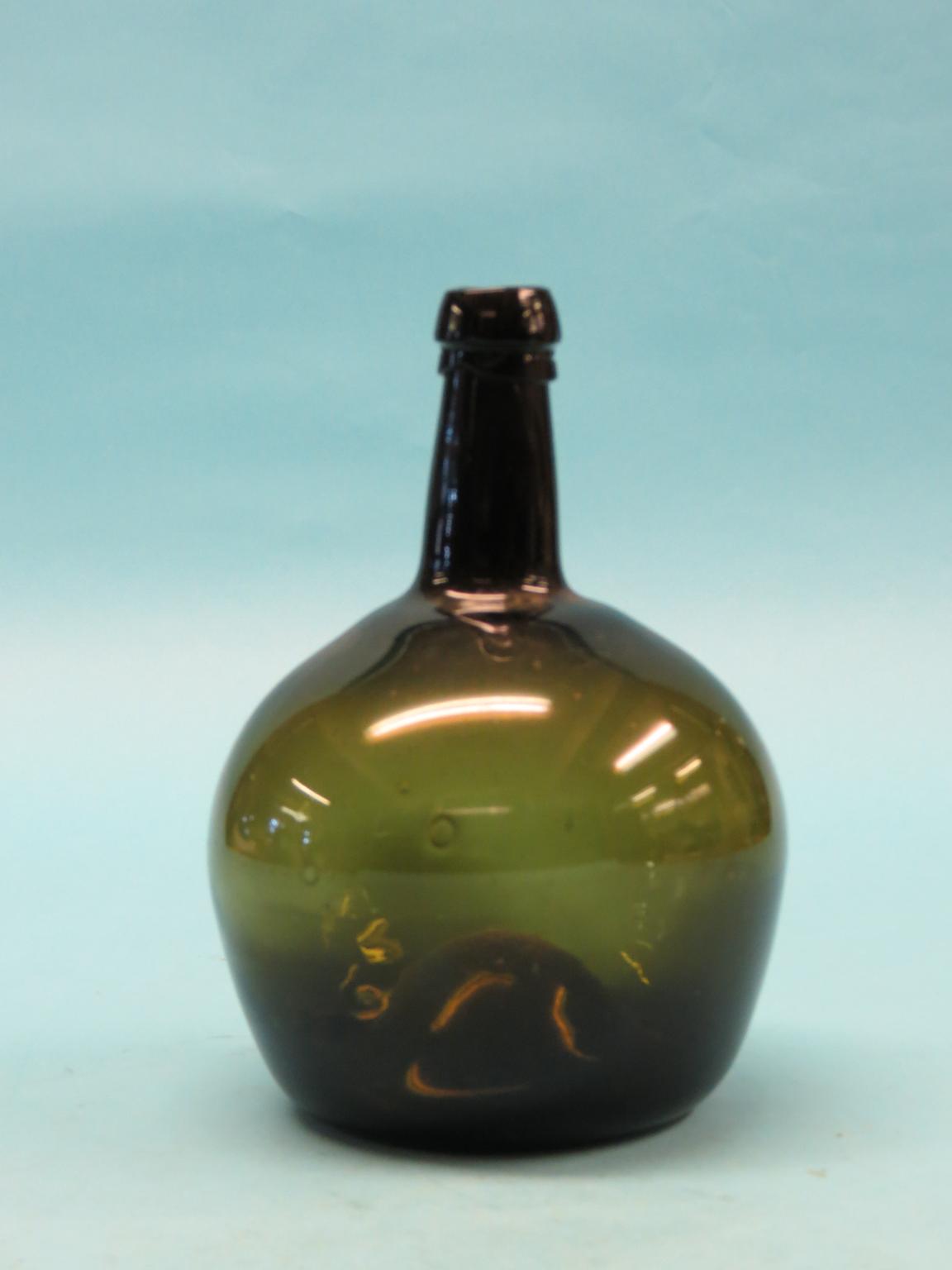 Appraisal: A mid- th century English glass wine bottle deep green