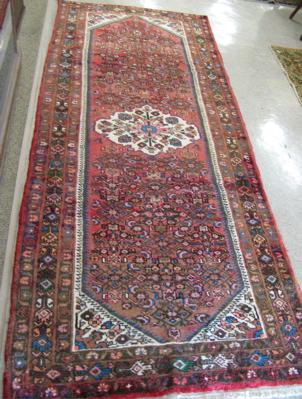 Appraisal: PERSIAN AREA RUG northwestern tribal central floral medallion with surrounding