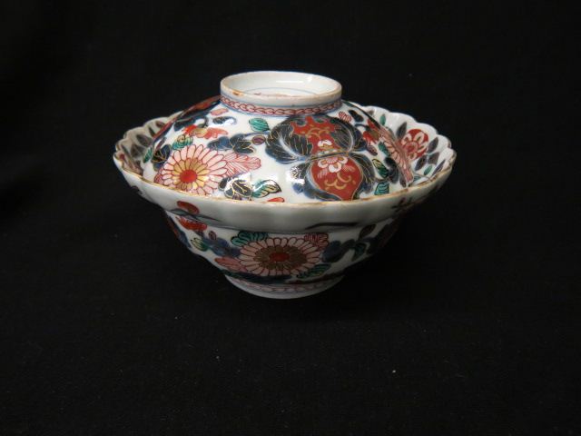 Appraisal: Japanese Imari Porcelain Covered Bowl fancy florals trimmed in gold