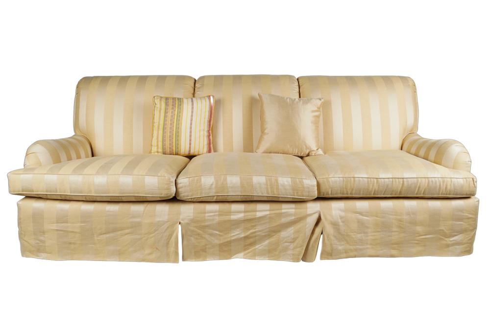 Appraisal: STRIPED UPHOLSTERED SOFAwith removable cushions and two mismatched throw cushions