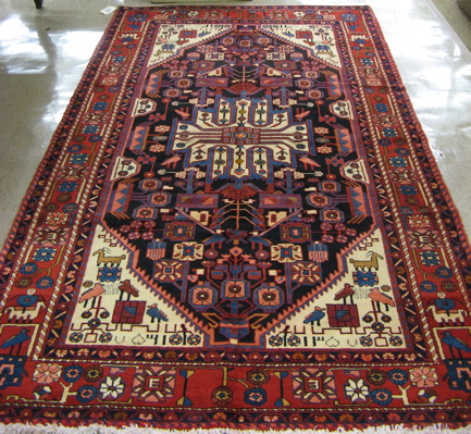 Appraisal: PERSIAN HAMADAN CARPET central medallion stylized floral and animal figure