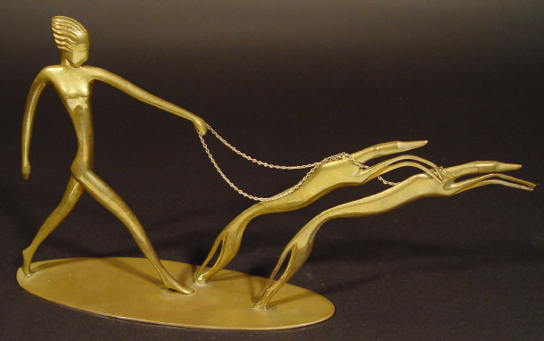 Appraisal: Art Deco Hagenauer figure clutching two prancing whippets stamped manufacturers