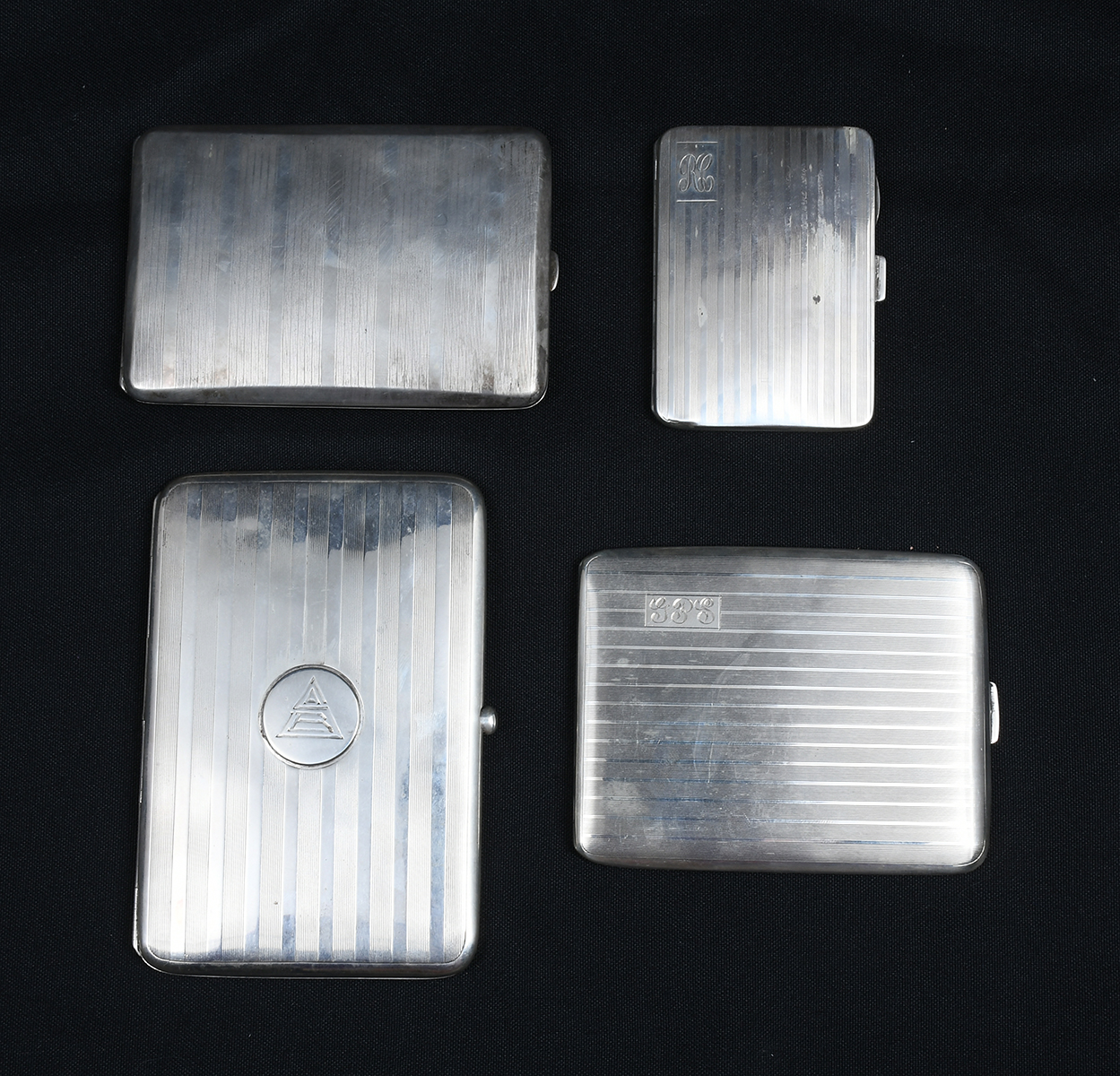 Appraisal: STRIPED ART DECO STERLING CIGARETTE CASES Comprising - impressed Hallmark