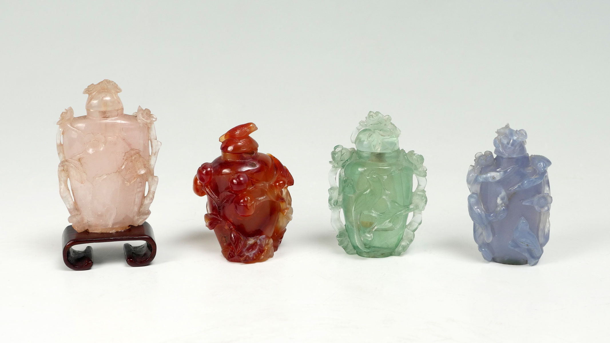 Appraisal: CARVED CHINESE SNUFF BOTTLES Comprising - Pink Quartz bottle having