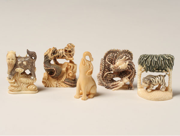 Appraisal: Japanese carved ivory netsukes animals and beasts One ivory Tallest