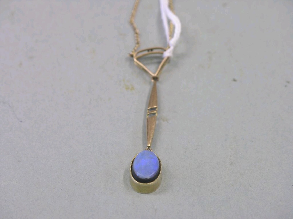 Appraisal: A ct gold chain with opal pendant