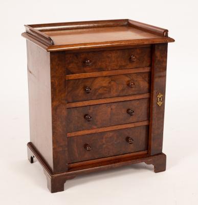 Appraisal: A small Regency mahogany Wellington chest the top with three-quarter