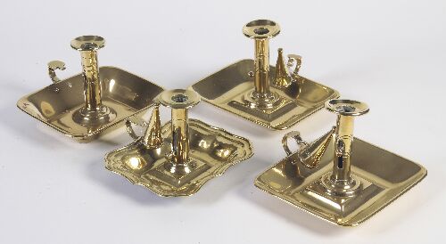 Appraisal: A pair of th century brass chambersticks of rectangular flared