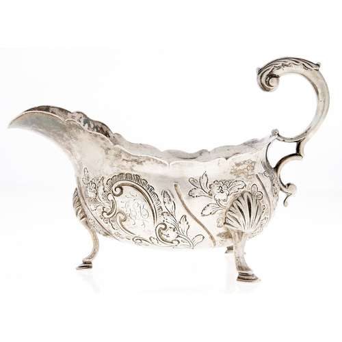 Appraisal: A George III silver sauce boat spirally fluted and chased