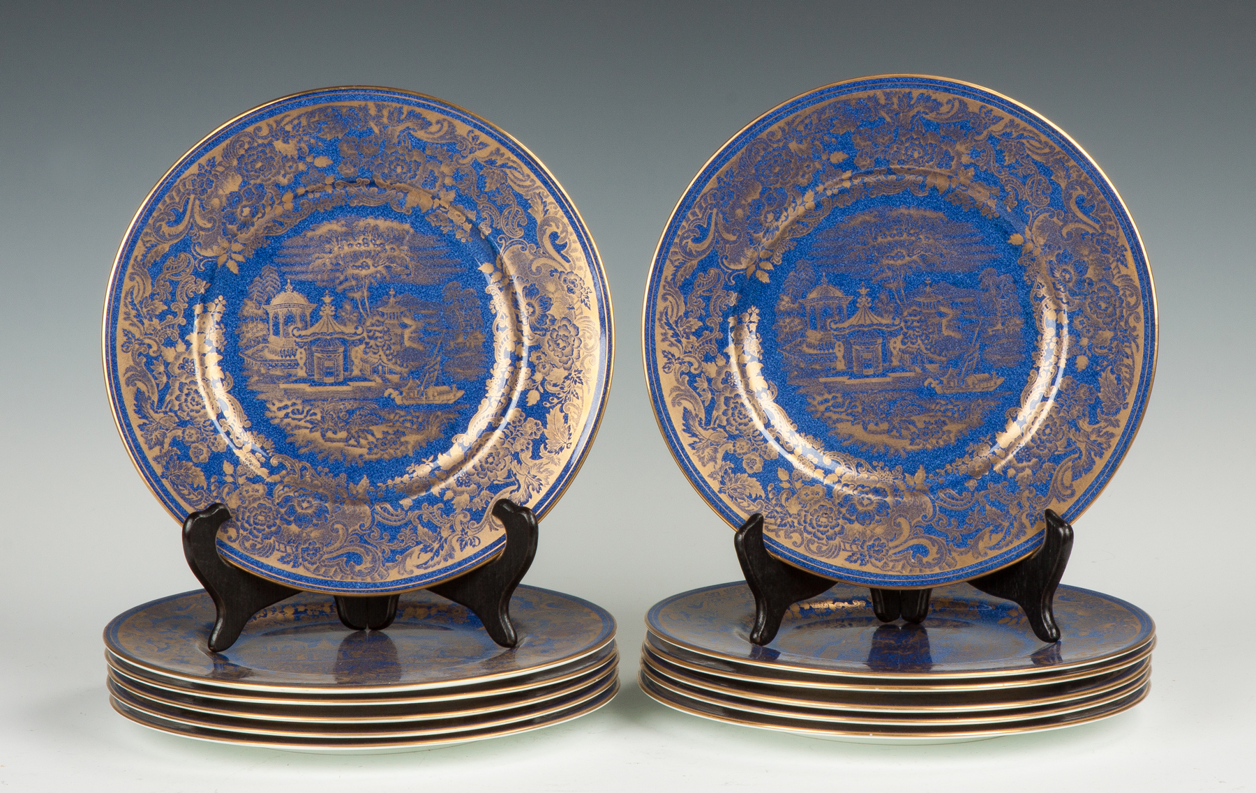 Appraisal: Set of Wedgewood Plates Blue background gold leaf oriental landscapes