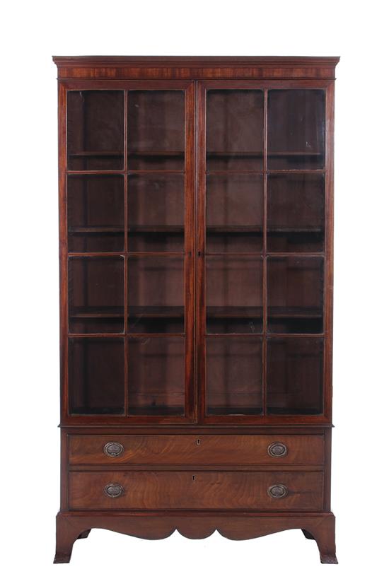 Appraisal: English mahogany bookcase mid th century pair glazed doors before