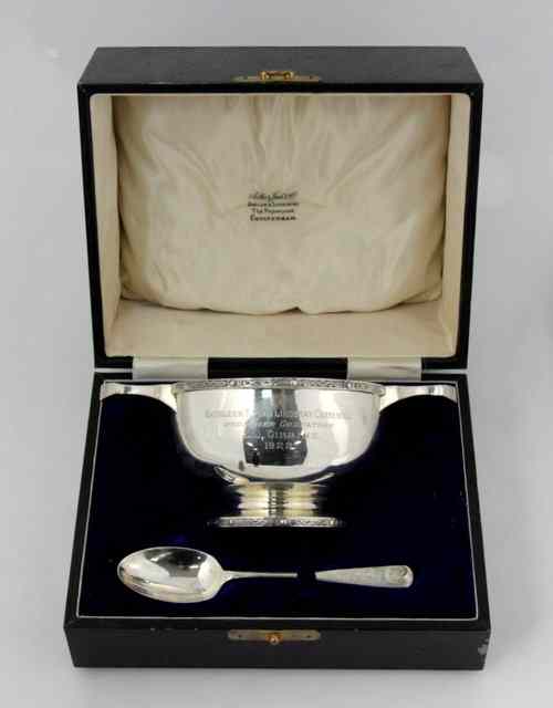 Appraisal: A silver quaich M C Edinburgh with moulded decoration to