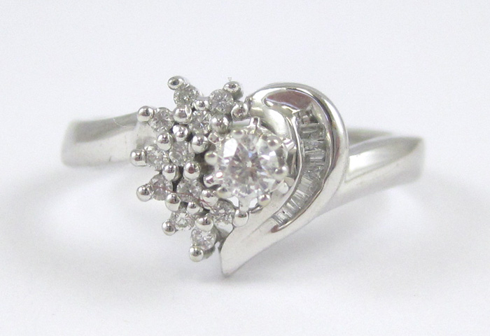 Appraisal: DIAMOND AND TEN KARAT WHITE GOLD RING with twelve round-cut