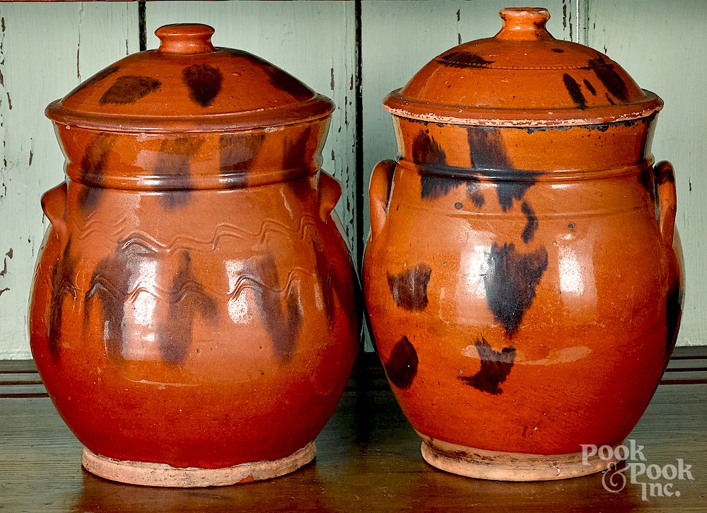 Appraisal: Two similar redware lidded crocks Two similar New England redware