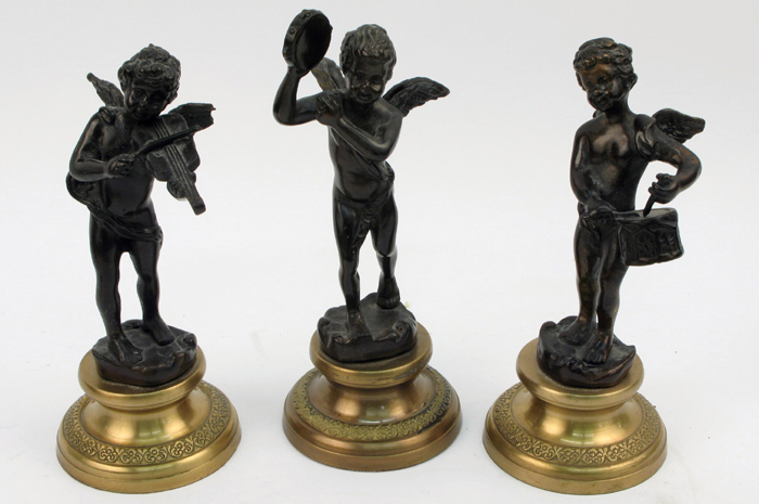 Appraisal: THREE FRENCH BRONZES each a winged cupid playing different instruments