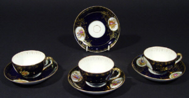 Appraisal: Three continental porcelain cups and four saucers each hand painted