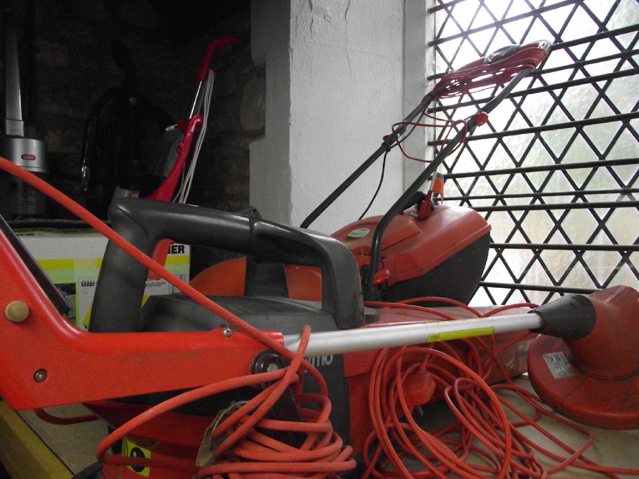 Appraisal: A Flymo Easimo electric lawn mower together with a further