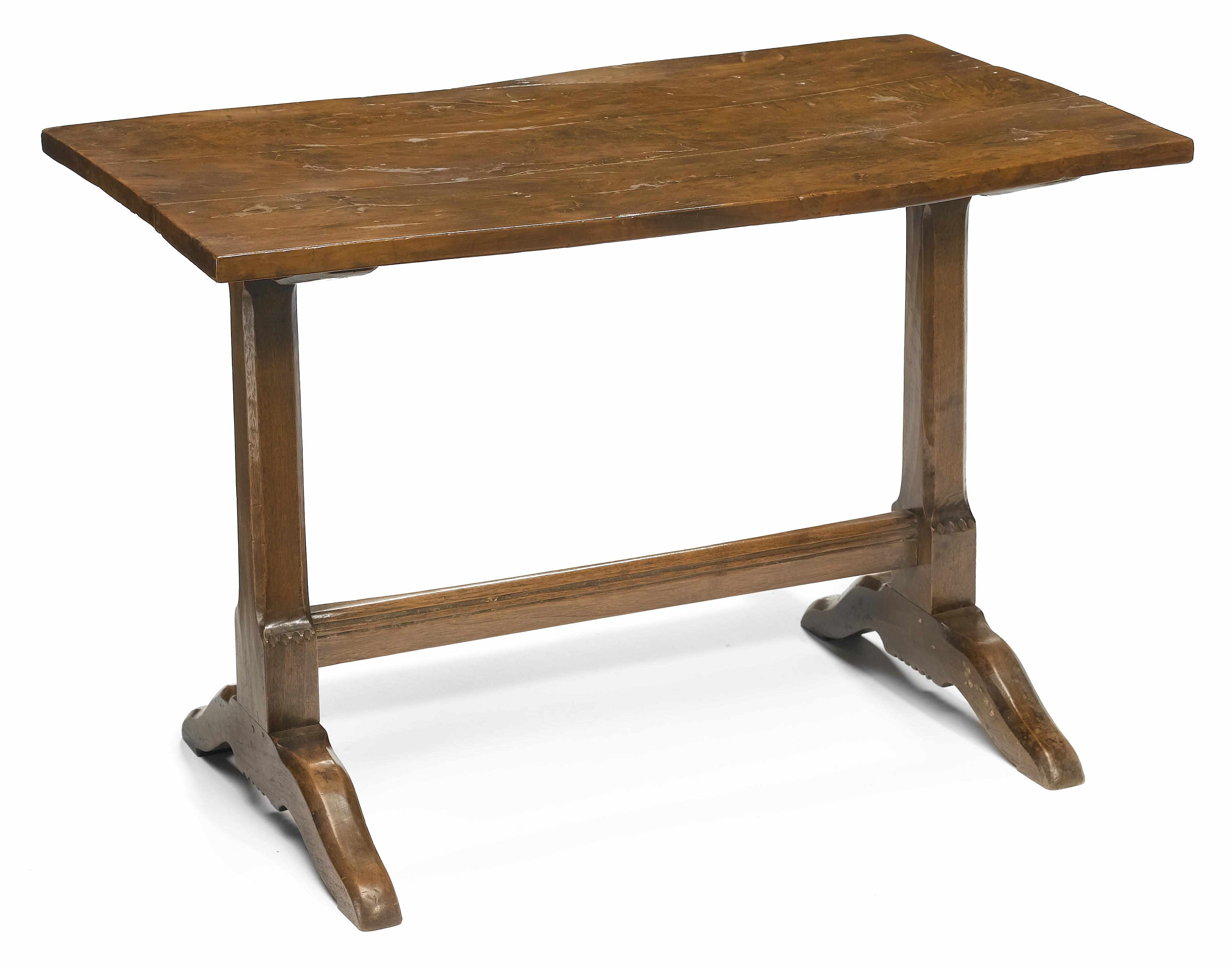 Appraisal: An English Baroque style yew and walnut low occasional table