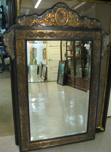 Appraisal: DECORATOR'S SHAPED WALL MIRROR in the Asian manner silvered copper