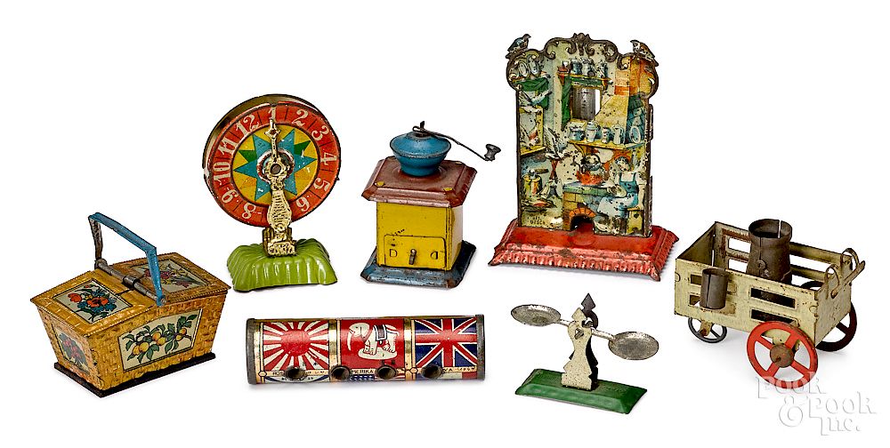 Appraisal: Seven tin lithograph penny toys Seven tin lithograph penny toys