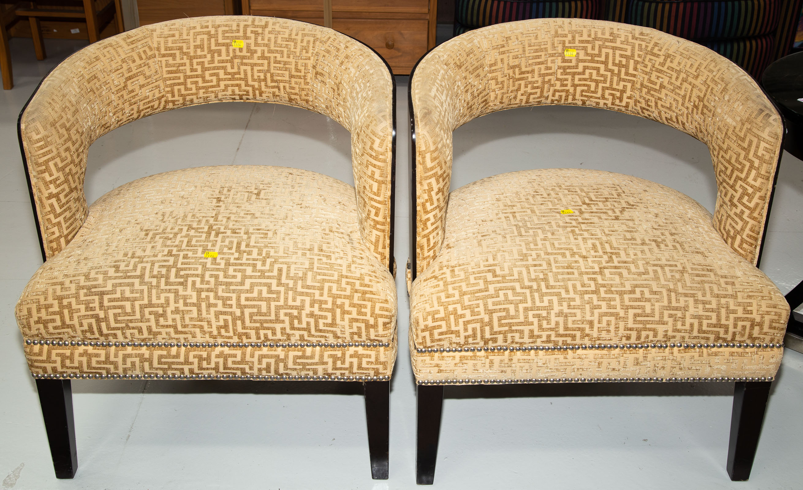 Appraisal: A PAIR OF ART DECO STYLE BARREL BACK CHAIRS Late