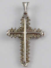 Appraisal: A white metal tests carat gold diamond cross pendant approx