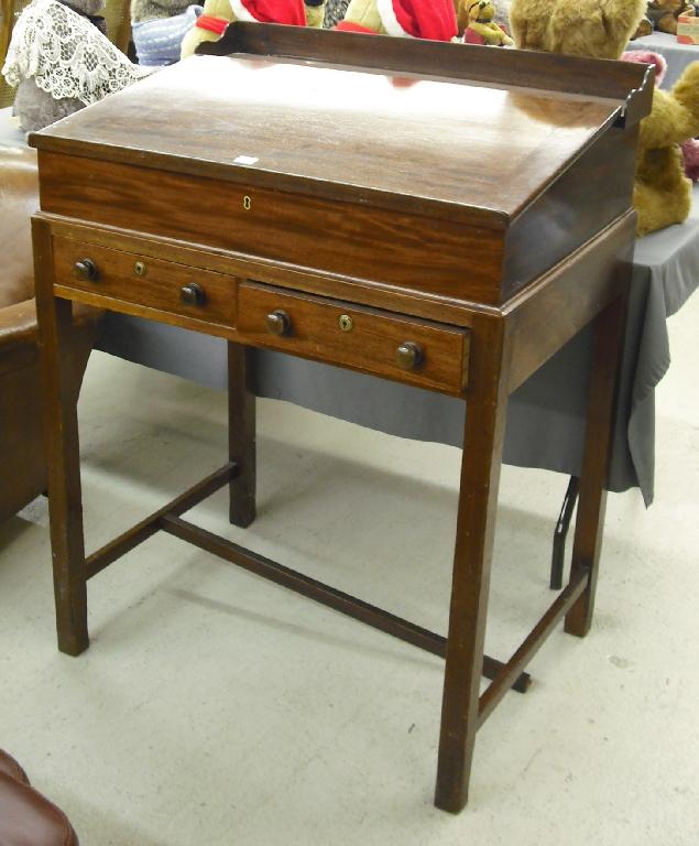 Appraisal: th century mahogany estate desk with a sloping front over