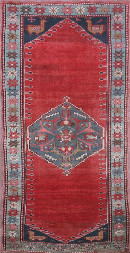 Appraisal: A Kazak rug early th century the plain red field