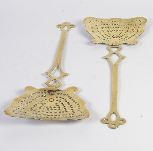 Appraisal: A pair of early th century brass cream skimmers with