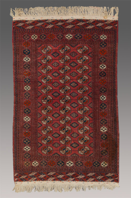 Appraisal: APPROX - YR OLD TURKOMAN BOKHARA HAND KNOTTED WOOL RUG