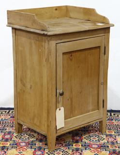 Appraisal: American Primitive style wash stand executed in pine having a