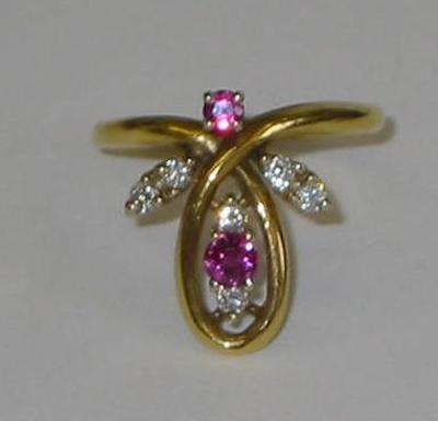 Appraisal: A RUBY AND DIAMOND RING the ct gold crossover band