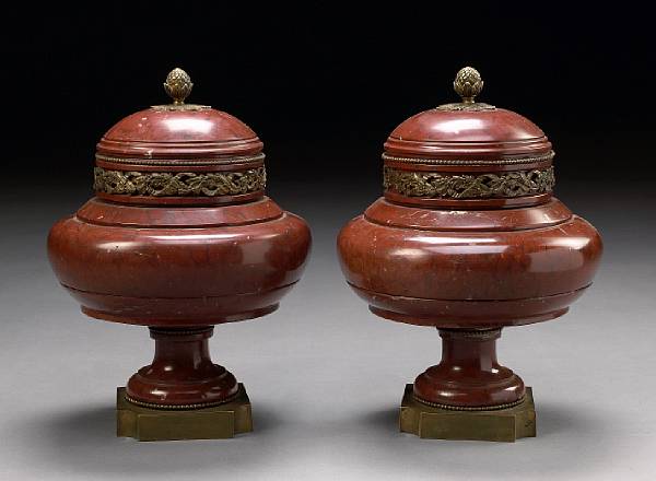 Appraisal: A pair of Louis XVI style bronze mounted rouge griotte