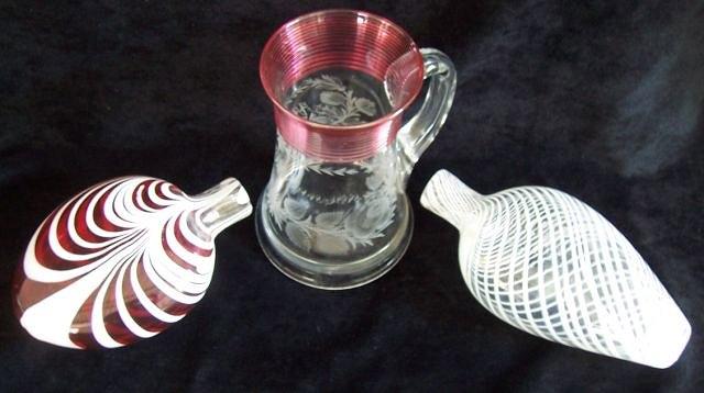 Appraisal: A ruby flash glass flask with trailed white decoration cm