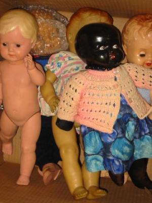 Appraisal: A composition head black baby doll and four various plastic