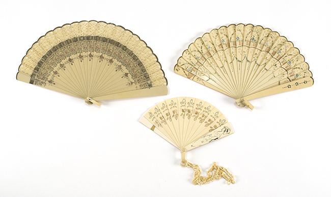 Appraisal: THREE CELLULOID FOLDING FANS Two bris fans simulating pierced ivory