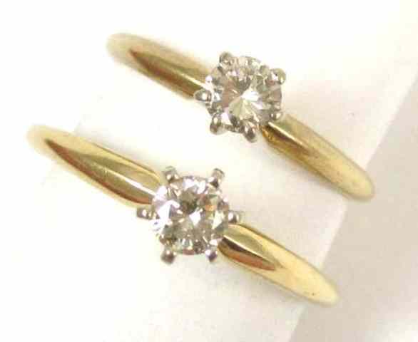 Appraisal: TWO DIAMOND SOLITAIRE RINGS each k yellow gold set with