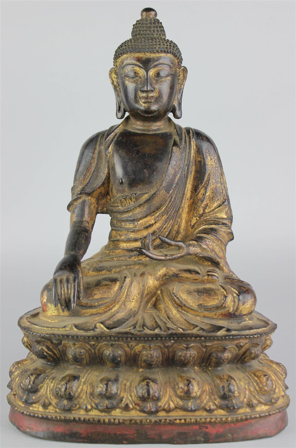 Appraisal: SINO-TIBETAN SEATED BUDDHA WITH POLYCHROME TRACES the Buddha in a