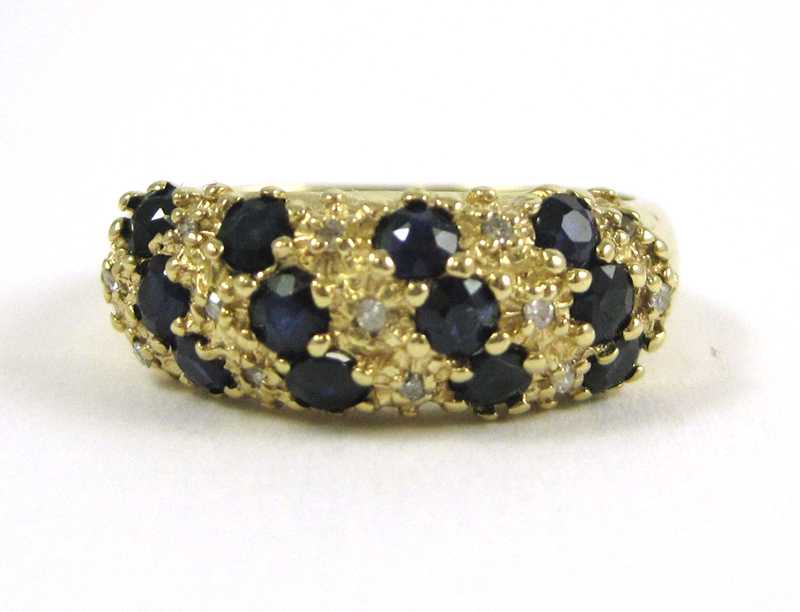 Appraisal: TEN KARAT GOLD SAPPHIRE AND DIAMOND RING having round-cut diamonds